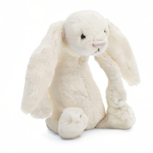 Small Jellycat Bashful Cream Bunny stuffed animal, 7 inches, featuring soft fur and floppy ears, sitting on a neutral background.