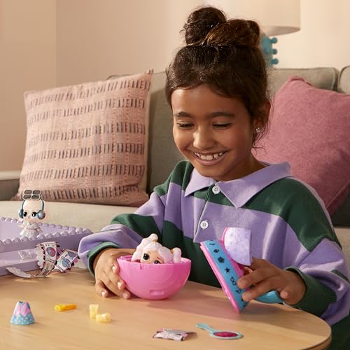 L.O.L. Surprise! Eye Spy Tots doll in blind packaging with color-change feature, fashion items, and accessories displayed.