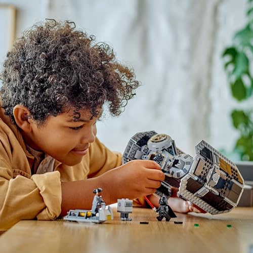 LEGO Star Wars 75347 TIE Bomber model with Gonk Droid and Darth Vader minifigure, showcasing torpedo-dropping feature.