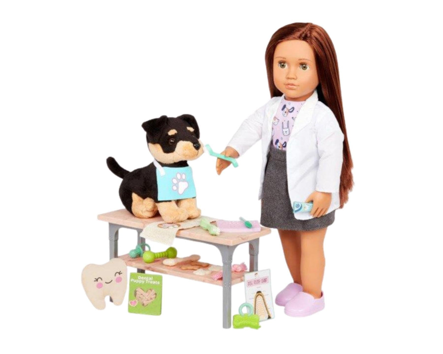 Our Generation canine care dentist set with dental tools, chew toys, and treats for 18-inch dolls in a playful vet scene.