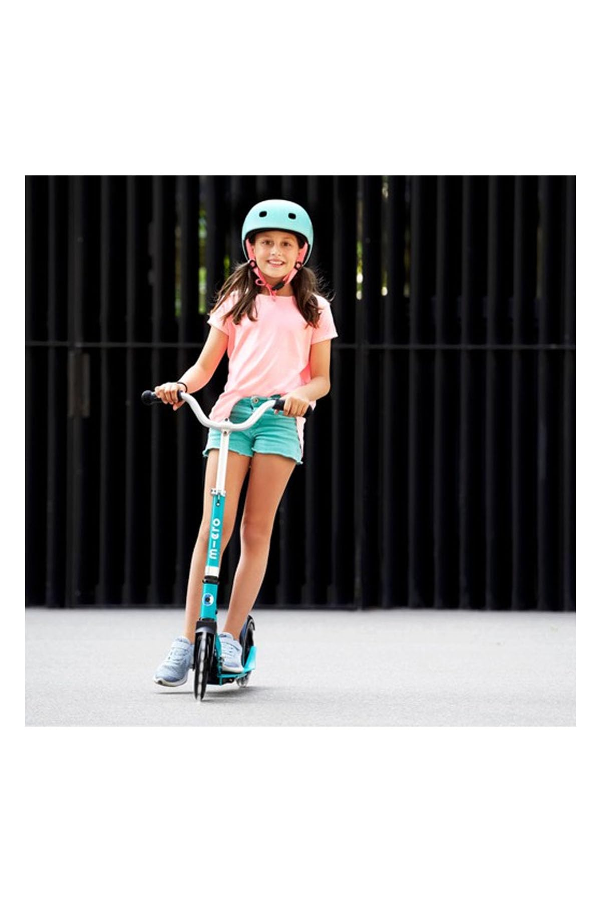 Aqua Micro Cruiser LED children's scooter with adjustable handlebar, light-up wheels, and foldable design for ages 5-12.