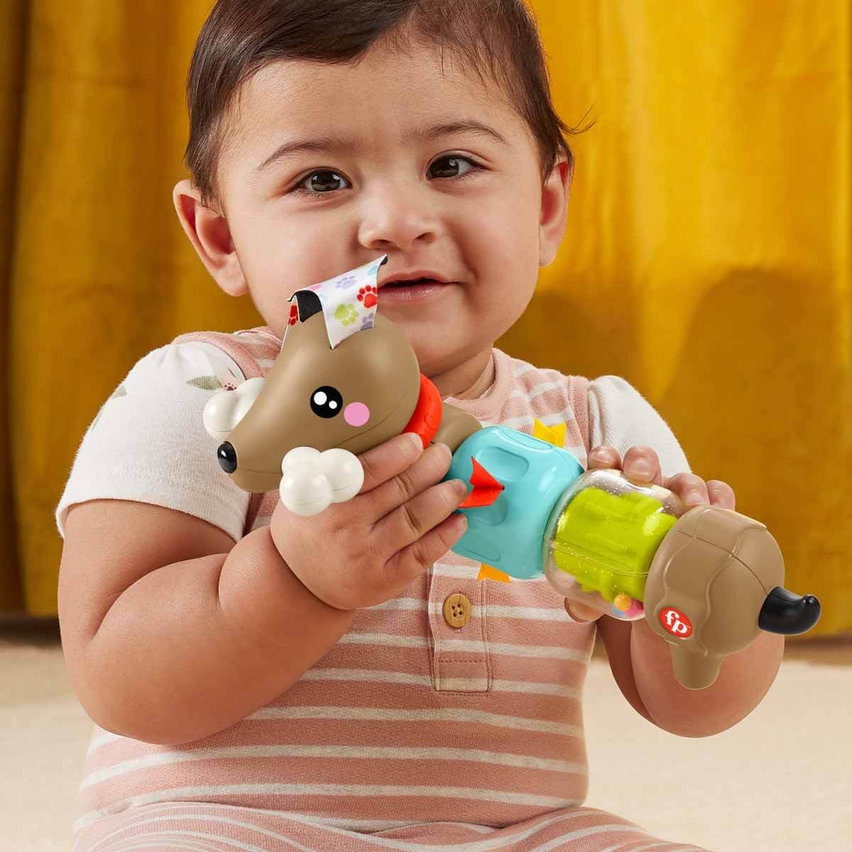 Fisher-Price Baby Sensory Toy FP Pets Click & Spin Activity Pup with colorful buttons and spinning features for infants 6+ months.