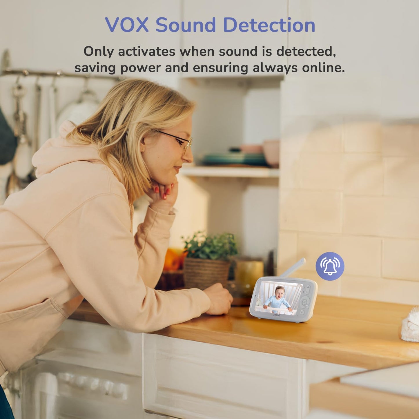 Jeeber 2K WiFi smart baby monitor with camera, 5-inch screen, night vision, two-way talk, and motion detection in a nursery setting.