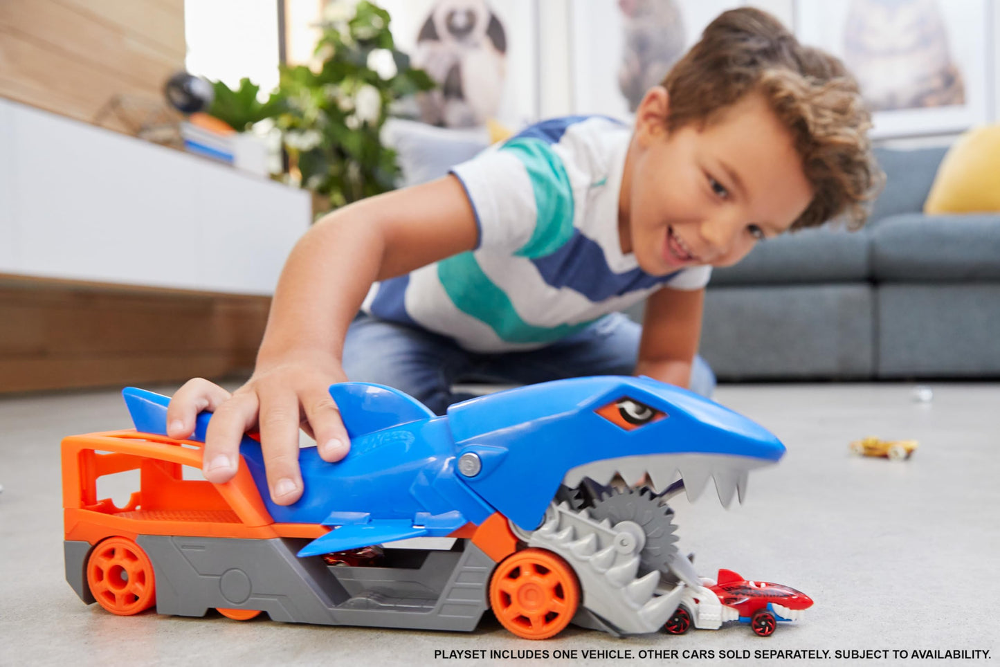 Hot Wheels Shark Chomp Transporter Playset with diecast car, featuring a shark-themed design and vibrant colors.