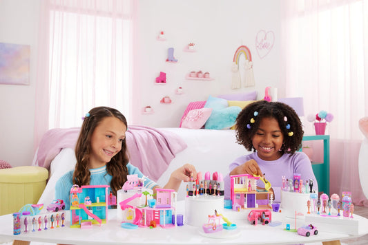 Mini Barbie Dreamhouse set with 1.5-inch Barbie doll, furniture, accessories, elevator, and pool.