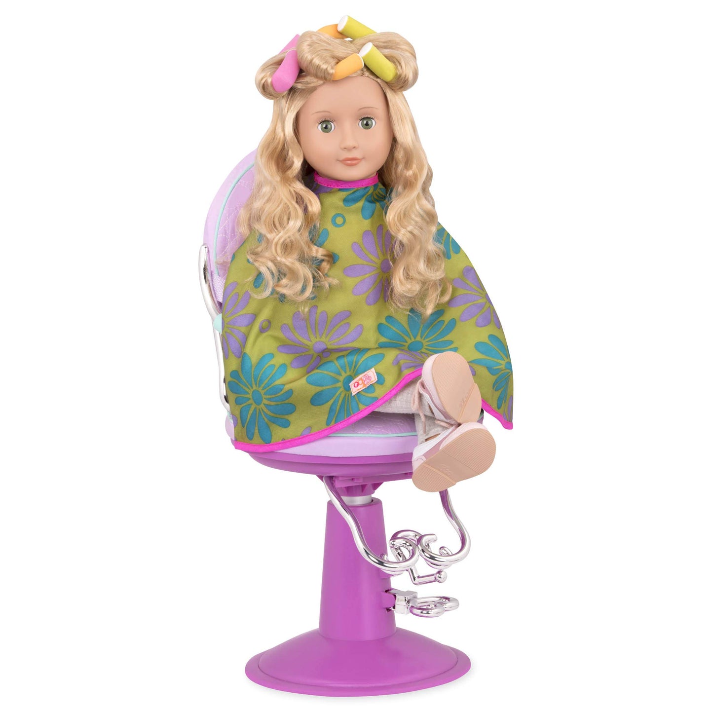 Our Generation salon set featuring a styling cape, brush, and curlers for 18-inch doll accessories.