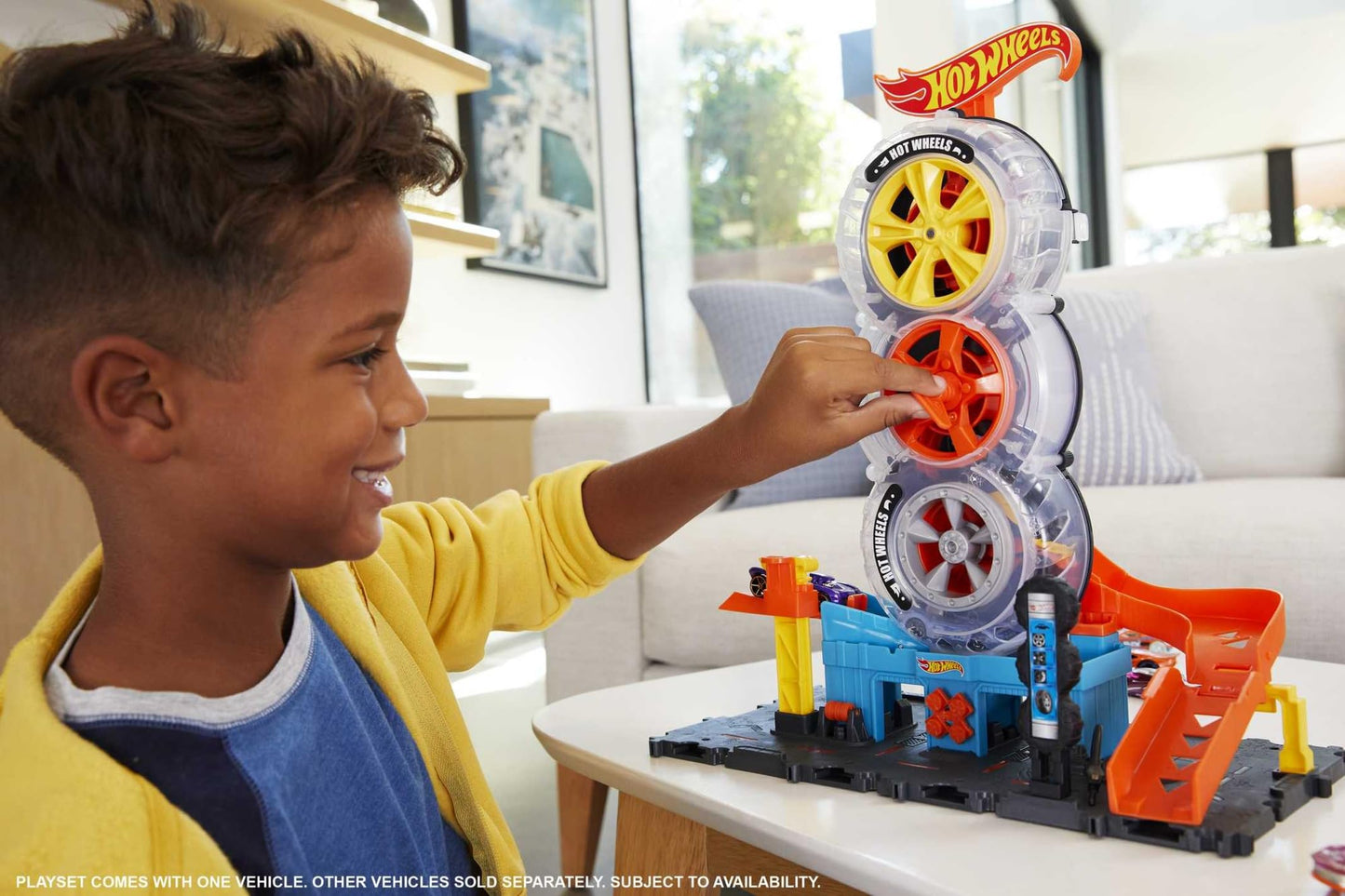 Hot Wheels City Super Twist Tire Shop Playset with spinning key and one Hot Wheels car for kids ages 4 to 8.