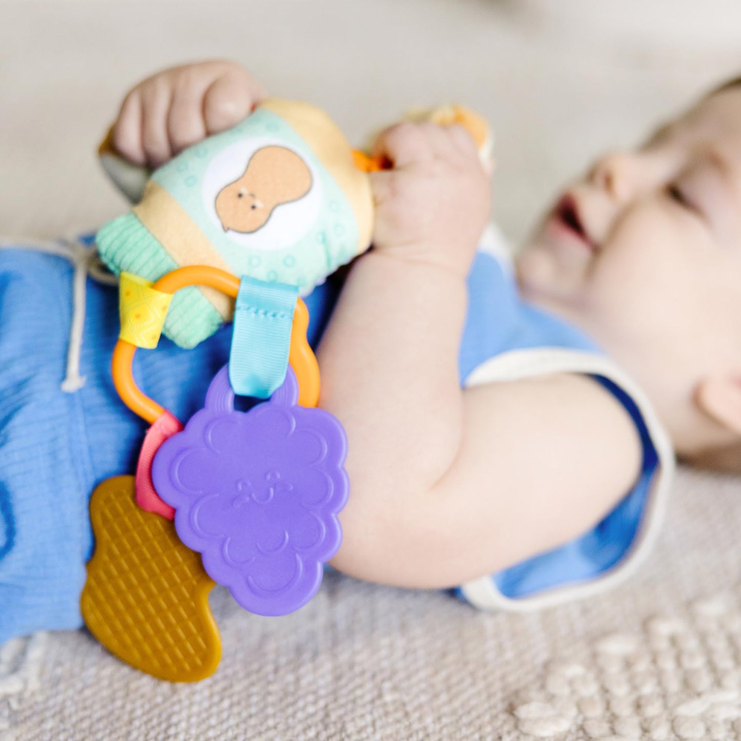 Melissa & Doug multi-sensory PB&J take-along clip-on baby toy with colorful textures for infants and toddlers.