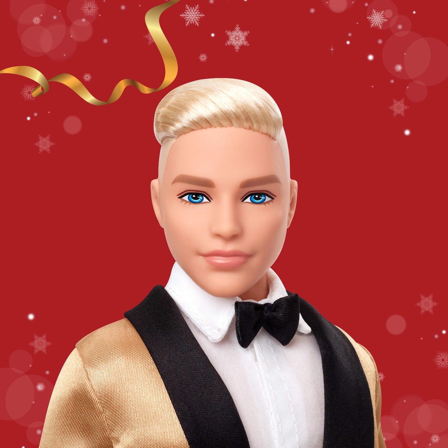Barbie Signature 2025 Holiday Blonde Ken doll in a golden suit, displayed in packaging with a doll stand.
