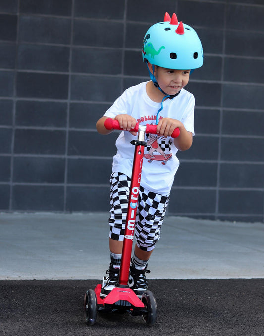 Red Maxi Micro LED Deluxe children's scooter with big wheels and adjustable handlebar for ages 5-12.
