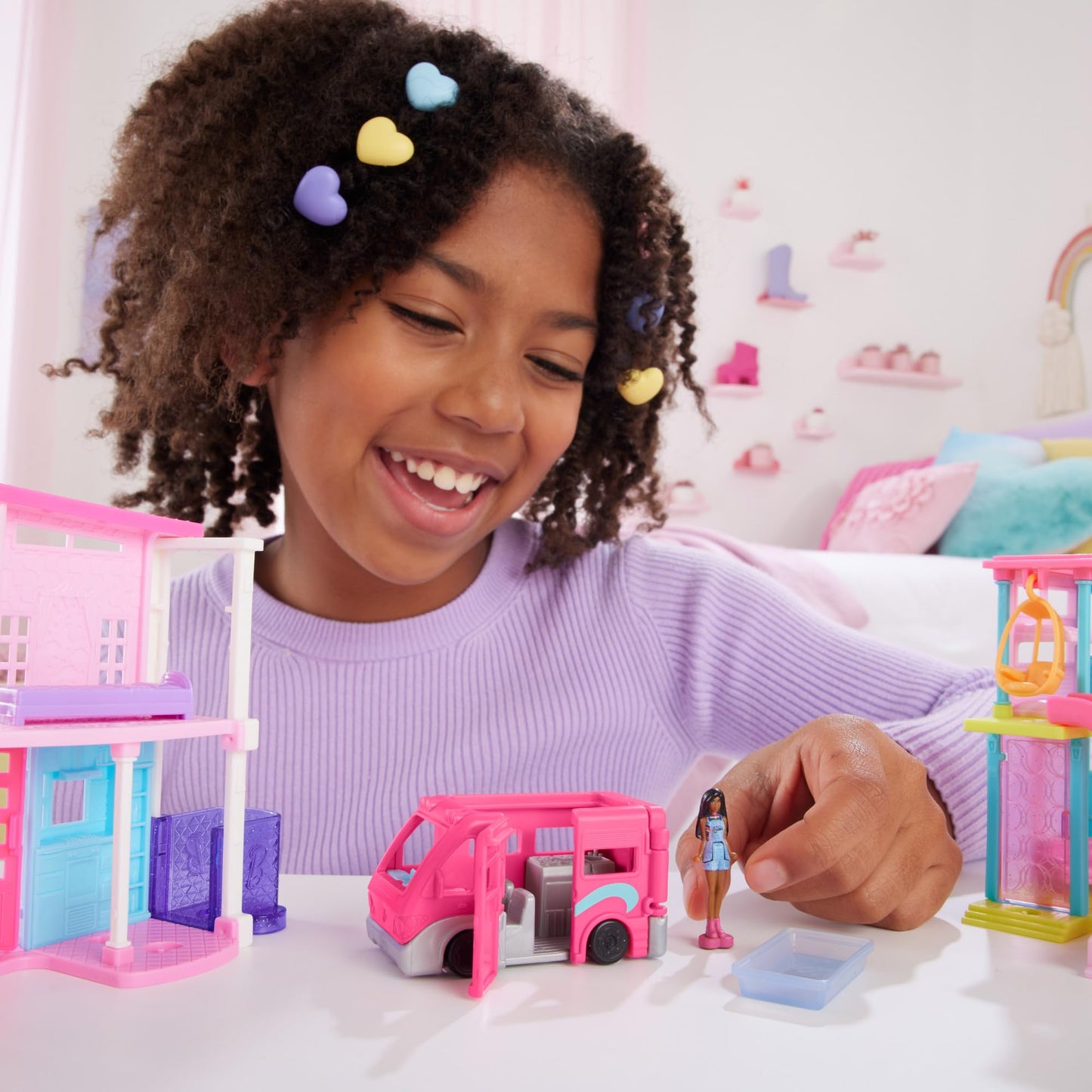 Mini BarbieLand doll and DreamCamper toy set with working doors and color-change pool, includes 1.5-inch Barbie doll and vehicle