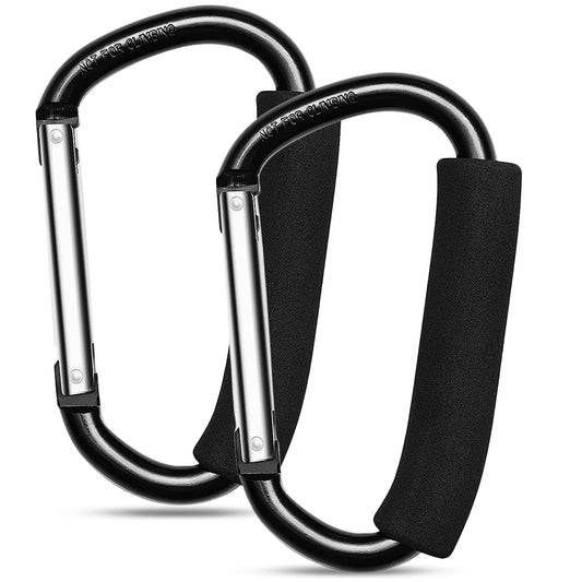 Two black heavy-duty aluminum buggy clips with carabiners attached to stroller for holding bags and diaper bags.