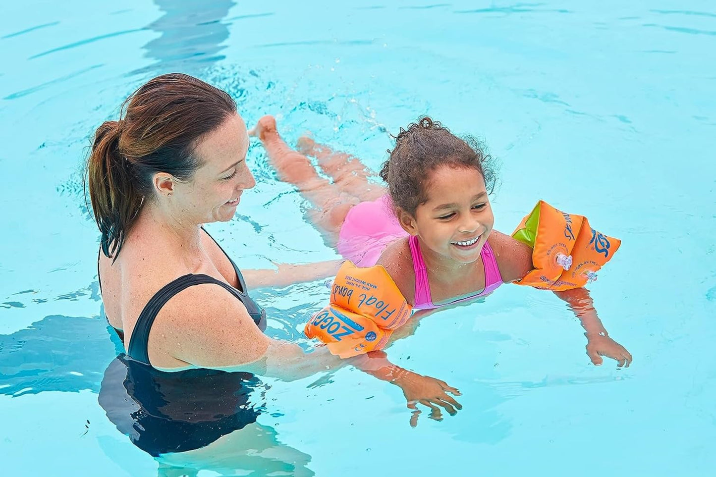 Zoggs orange swimming aid arm bands for children aged 6-12 years, designed for weights 25-50 kg.