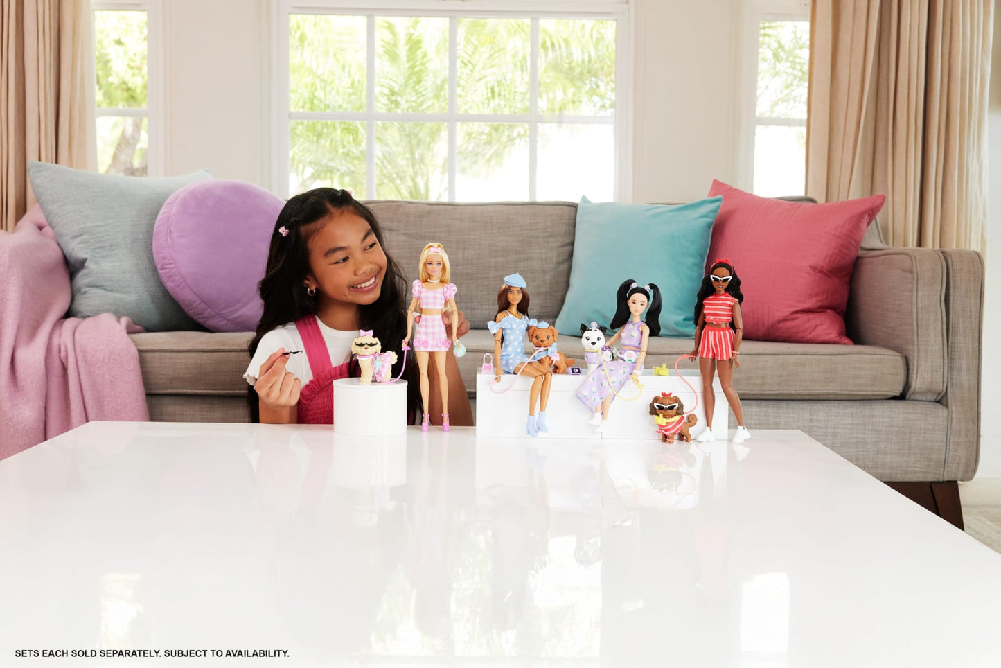 Barbie Twinning Looks Doll and pet dog in matching pink gingham outfits with accessories like sunglasses and bows.