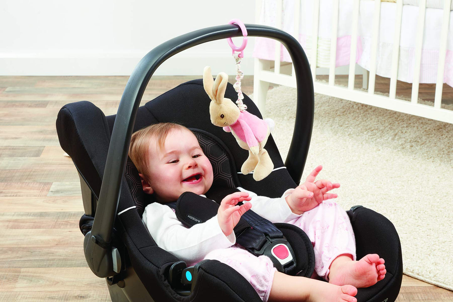 Pink Peter Rabbit pram toy featuring Flopsy from Rainbow Designs, soft plush jiggle attachment for baby strollers and cribs.