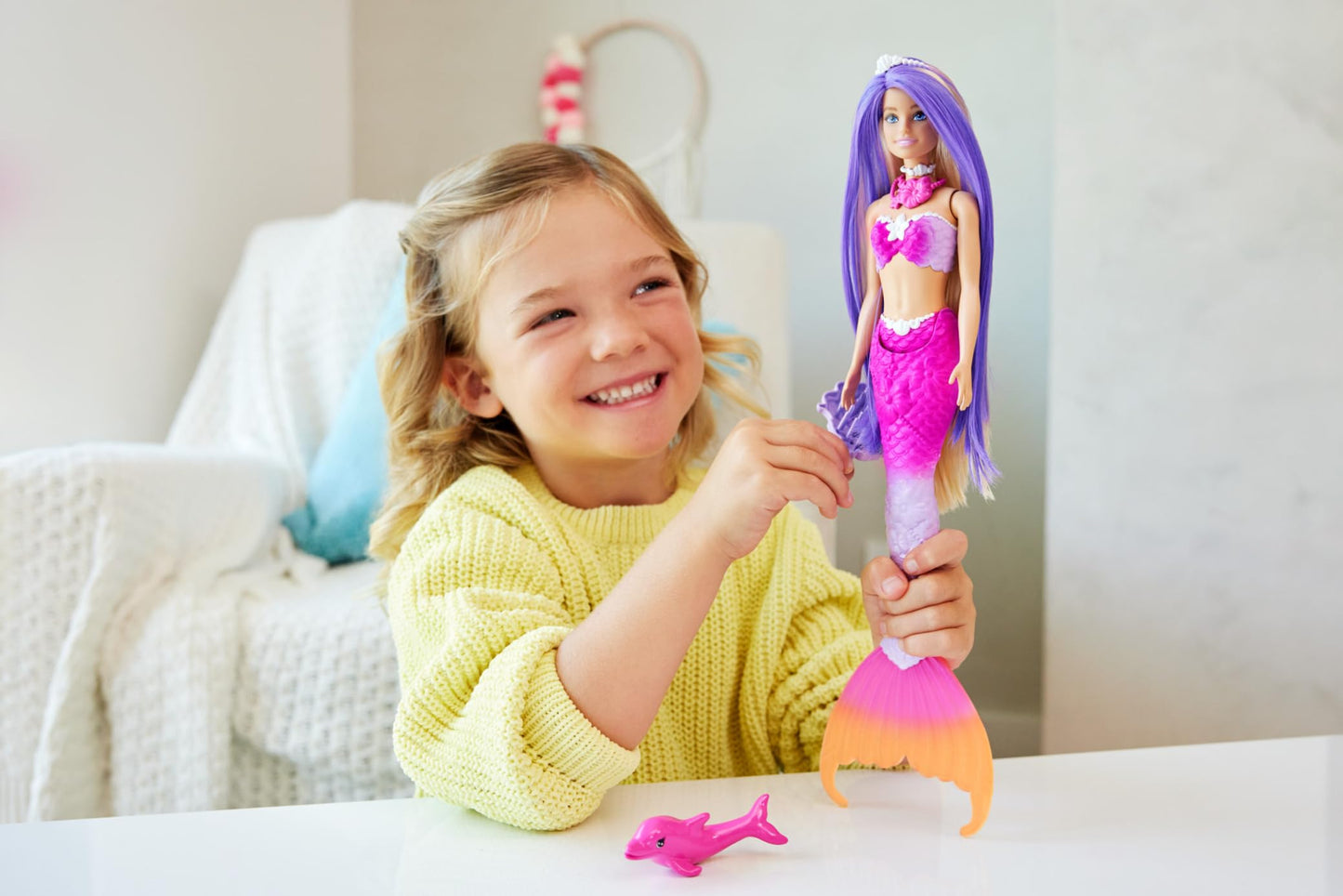 Barbie Malibu mermaid doll with pink hair, styling accessories, and pet dolphin showcasing water-activated color change feature.