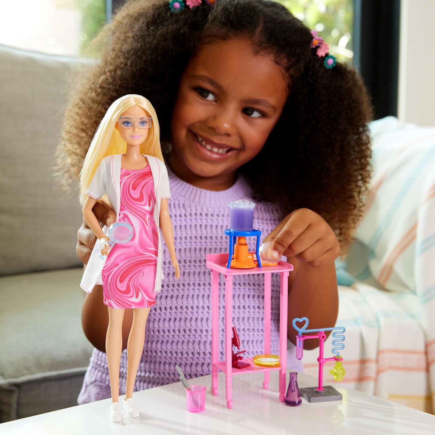 Barbie Scientist doll with blonde hair, lab table, microscope, color-change beaker, and petri dish accessories for imaginative play
