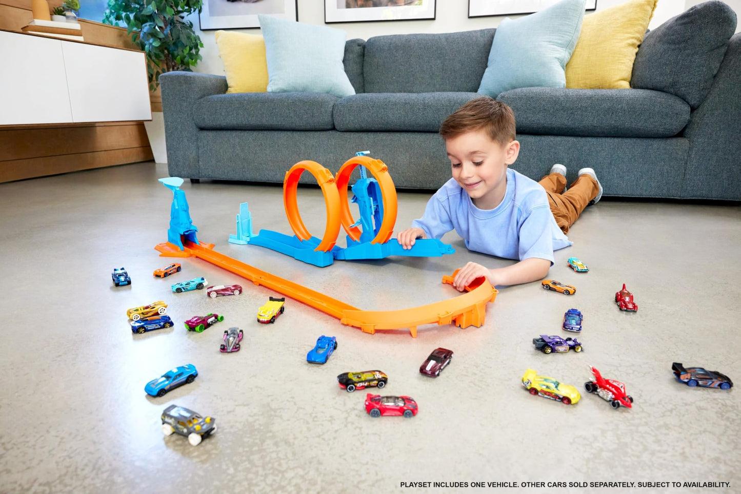 Hot Wheels Triple Loop Toy Car Track Set with 1:64 scale vehicle and track-building components featuring three loops.