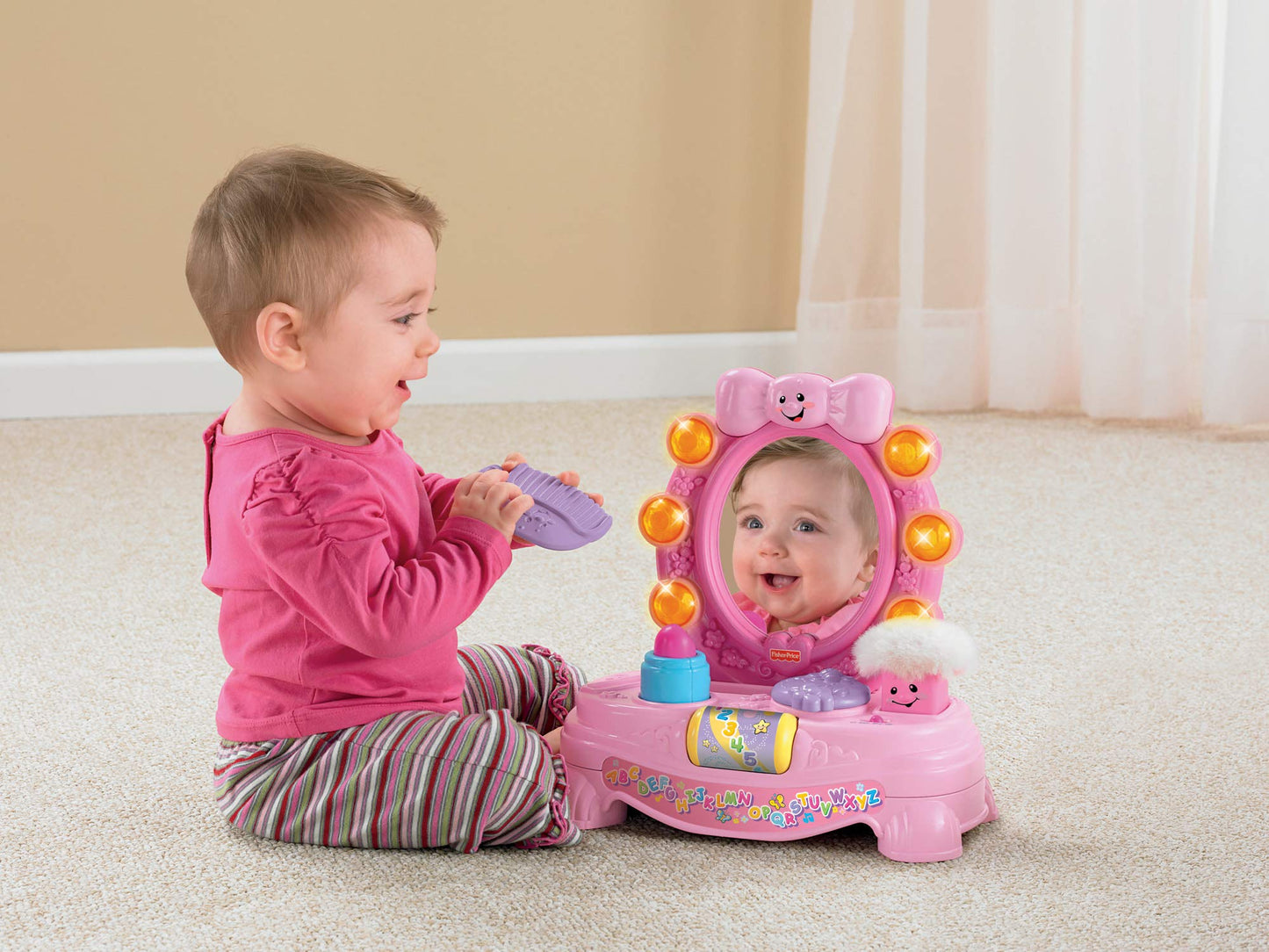 Fisher Price Laugh and Learn Magical Musical Mirror by Mattel showing a colorful kids' mirror with musical and learning features