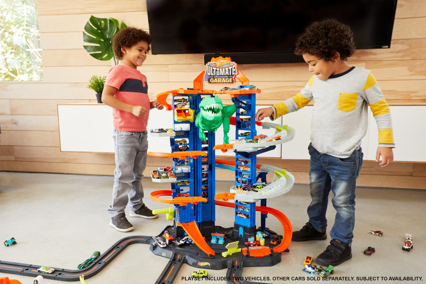 Hot Wheels City Ultimate Garage Playset with T-Rex, multi-level racetrack, and space for 100 toy cars.