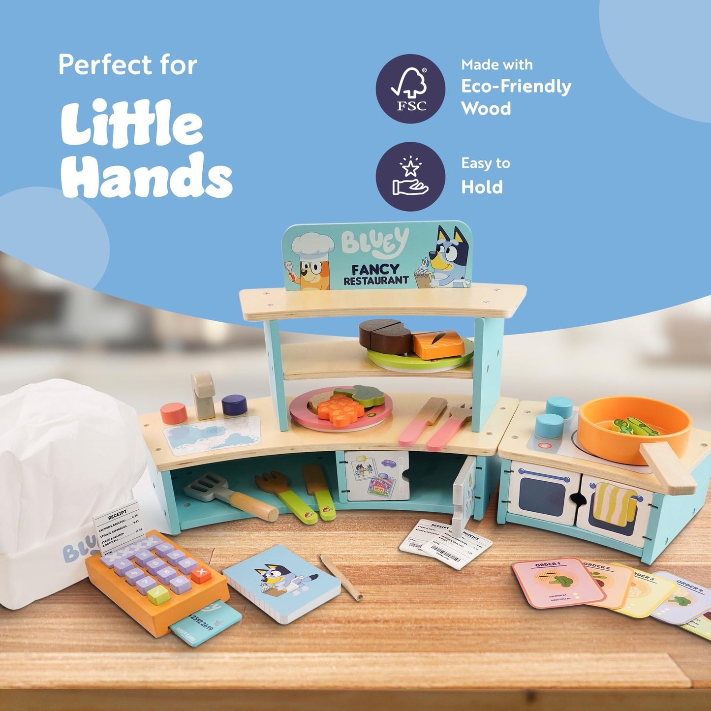 Bluey Wooden Tabletop Restaurant Playset with oven, sink, fridge, and accessories for kids aged 3+ in a colorful pretend kitchen scene.