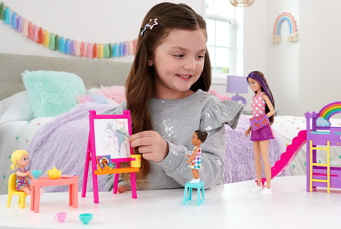 Barbie Skipper Babysitters Inc. daycare playset with dolls, furniture, bunk beds, and color-change easel accessories.