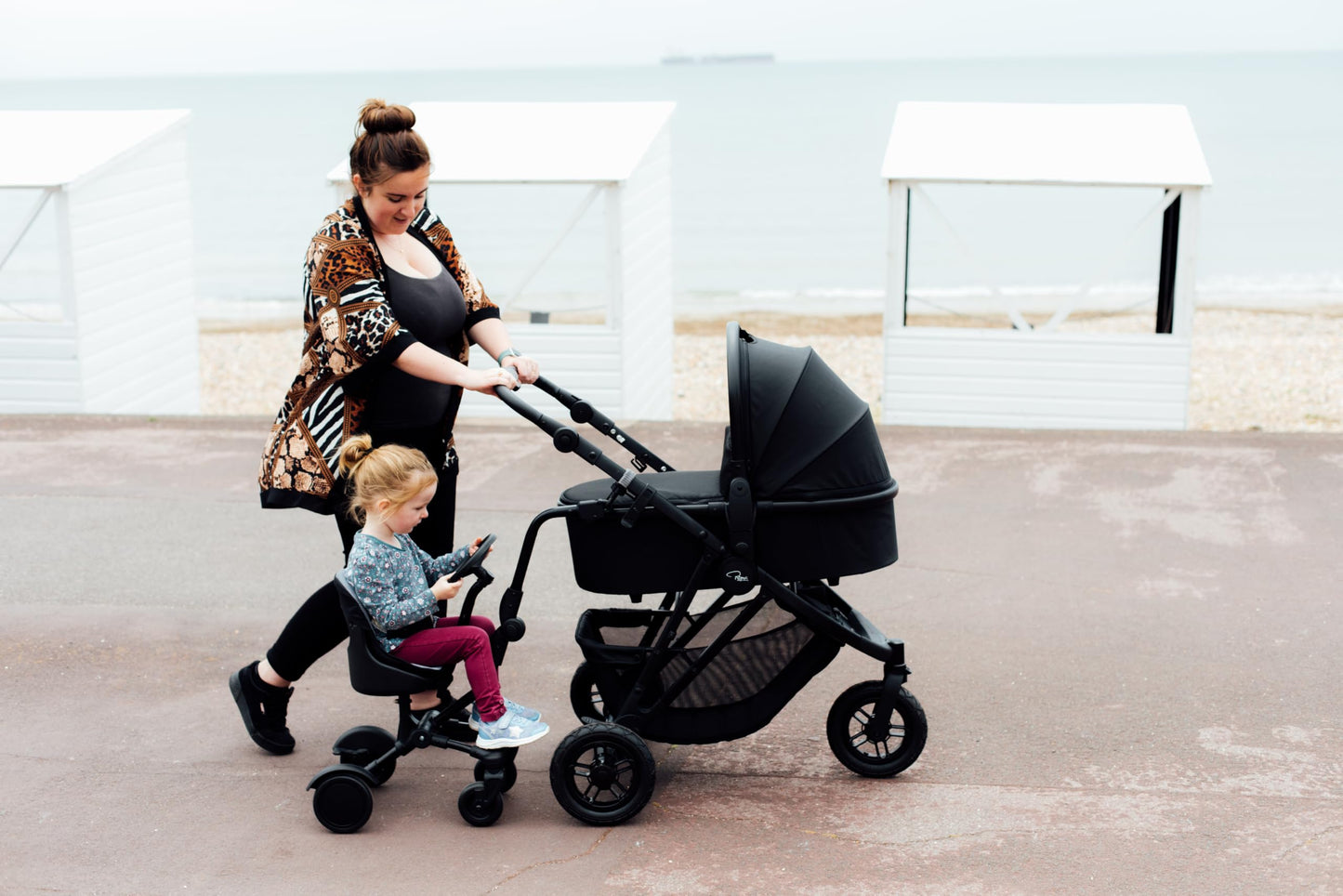 Roma Uptown 4 Wheel Toddler Seat & Steering Wheel, Universal Buggy Board with Seat, Side Attachment for Pushchairs & Buggies, Supports Up to 25kg, Eliminates Double Pram Need