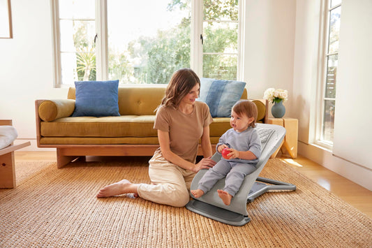 Ergobaby 3-in-1 Evolve Bouncer Mesh in light grey showing ergonomic baby rocker with breathable mesh fabric and newborn insert.