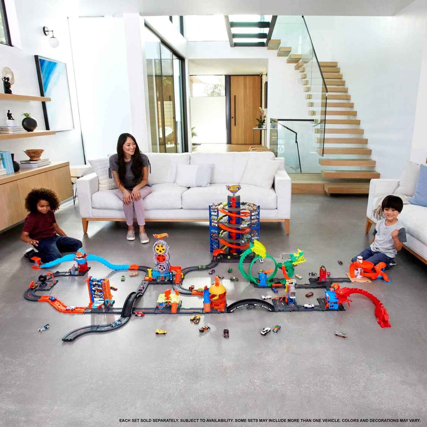 Hot Wheels Track Builder Unlimited Fuel Can Stunt Box with track pieces and storage for toy cars, designed for ages 6 to 12.