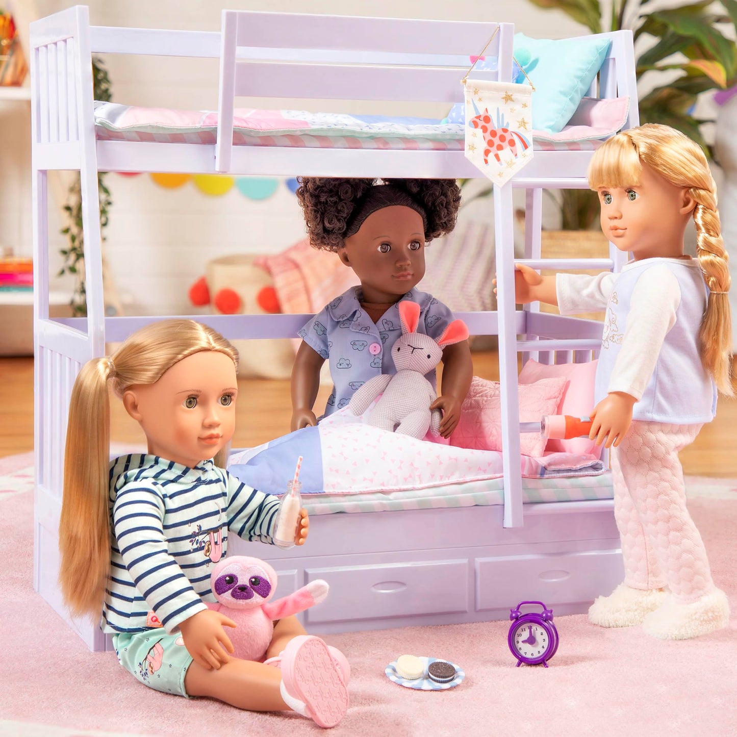 Our Generation 46 cm sleepover doll in pajamas with a soft toy rabbit, ideal for kids' cozy sleepover fun.