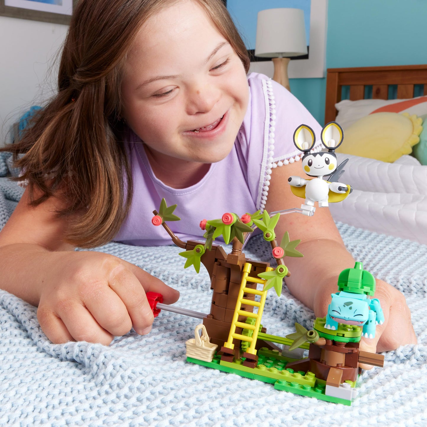 MEGA Pokémon Building Toys Set with Emolga and Bulbasaur in Charming Woods, featuring 194 pieces and 2 poseable characters.