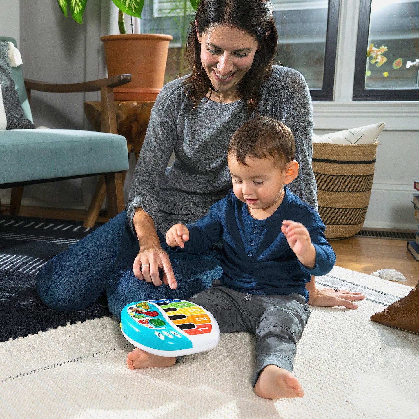 Baby Einstein Discover & Play Piano toy for babies, featuring colorful keys, animal illustrations, and multilingual learning functions.