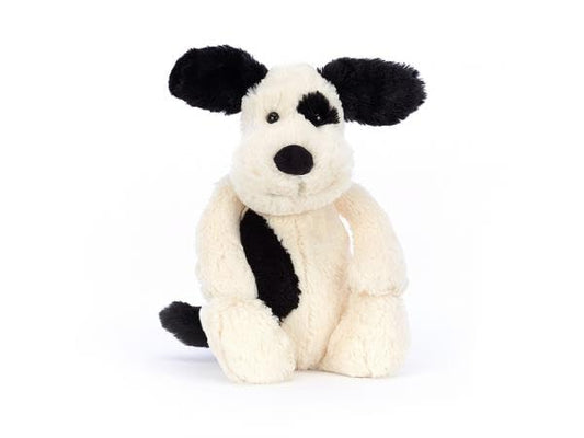 Medium Jellycat Bashful Black & Cream Puppy plush toy, soft and cuddly, measuring 9 cm x 12 cm x 31 cm.