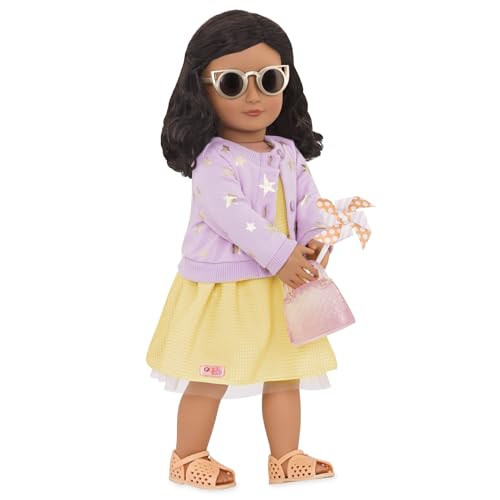 Our Generation 18-inch doll summer dress with sunny day accessories, featuring vibrant colors and playful designs.