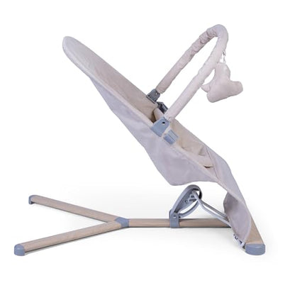 Red Kite Baya Bouncer in oatmeal with toy bar, ergonomic self-bouncing baby bouncer with adjustable features and soft fabric.