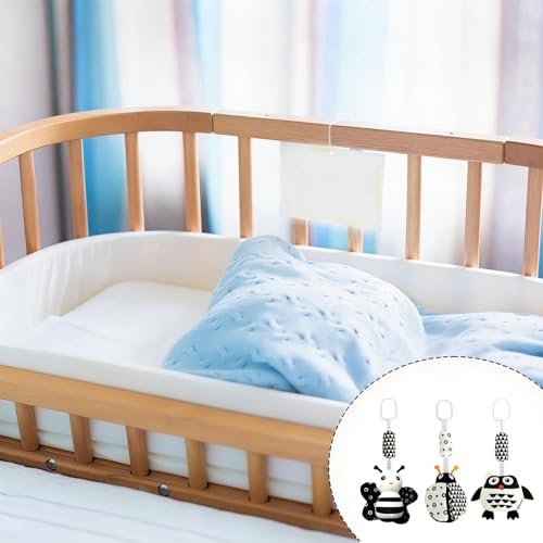 Three black and white hanging sensory gym toys featuring a ladybug, bee, and owl for ages 15+ by Mystiqut
