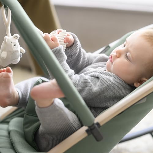 Maxi-Cosi Kori 2-in-1 ergonomic baby bouncer chair with toy arch, beige, featuring recline positions and easy-in harness for newborns.