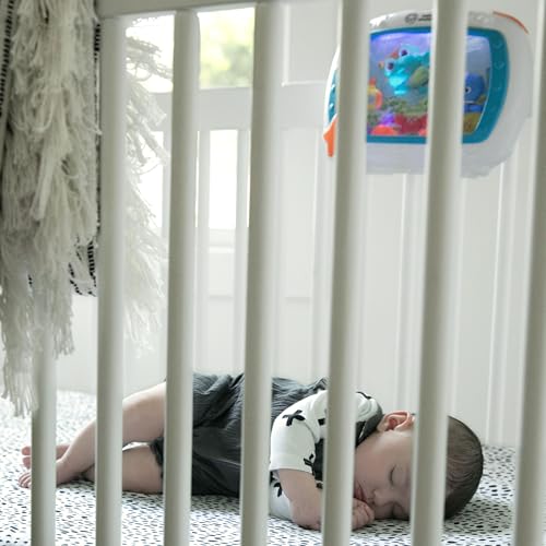 Baby Einstein Sea Dreams Soother crib toy with remote, calming lights, melodies, and sleep aid features for newborns and infants.