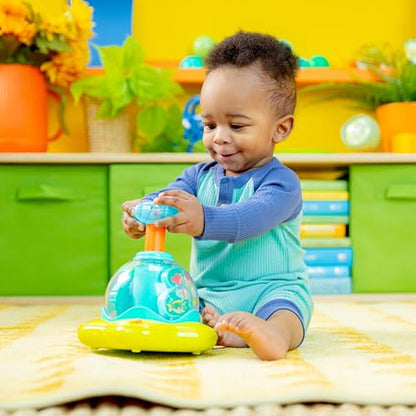 Bright Starts Press and Glow Spinner musical baby toy with multicoloured buttons, designed for infants 6 months and older.