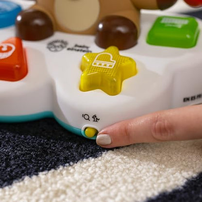 Baby Einstein Drum & Learn Dean musical toy with colorful buttons and sensors for multisensory learning, suitable for babies 6 months and up.