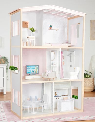 Our Generation dollhouse playset featuring movable furniture pieces for bedroom, kitchen, and bathroom pretend play.