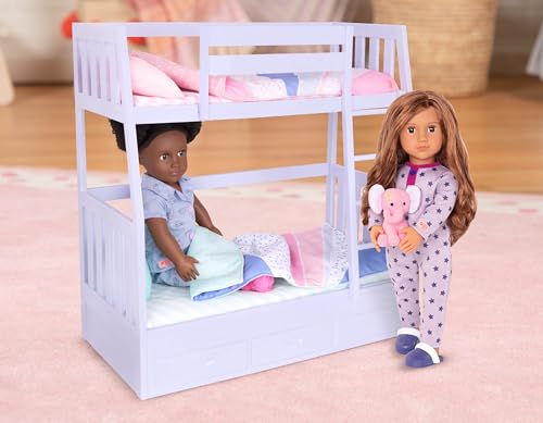 Our Generation Maria fashion doll in pink pyjama onesie, holding a plush elephant toy, poseable doll for children aged 3 to 12.