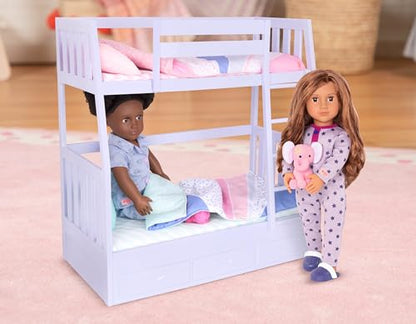 Our Generation Maria fashion doll in pink pyjama onesie, holding a plush elephant toy, poseable doll for children aged 3 to 12.