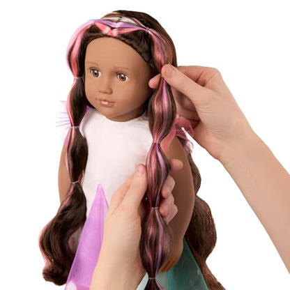 Our Generation 18-inch doll Tania with lifelike brown eyes and ultra-long rainbow hair, featuring styling accessories.