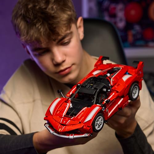 LEGO Technic Ferrari FXX K race car model with visible V12 engine, differential, and moving pistons in detailed assembly.