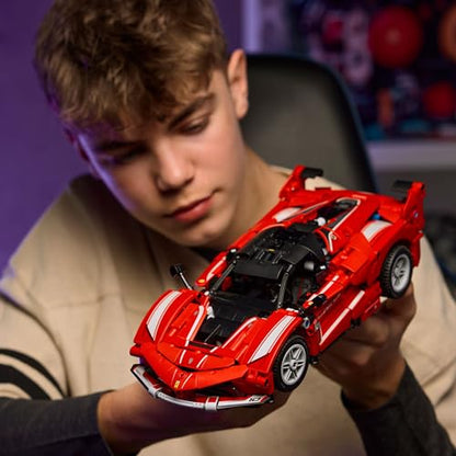 LEGO Technic Ferrari FXX K race car model with visible V12 engine, differential, and moving pistons in detailed assembly.