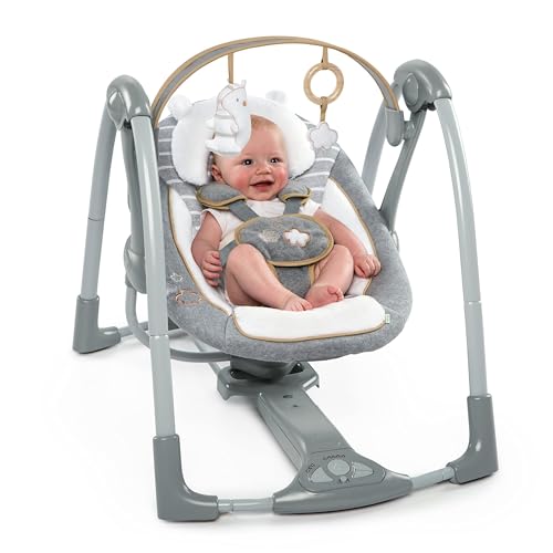 Ingenuity Swing 'n Go Deluxe baby swing with cushioned harness, plush toys, and sound features for infants 0-9 months.