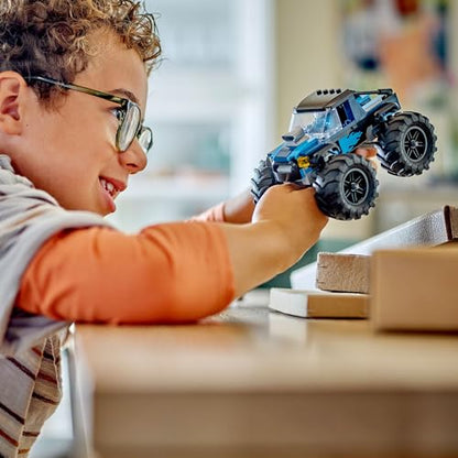 LEGO City blue monster truck toy with driver minifigure, designed for kids 5 and up, featuring vibrant colors and details.