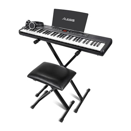 Alesis Melody 61 keyboard piano with 61 keys, speakers, stand, bench, headphones, tablet stand, and colorful controls for beginners.