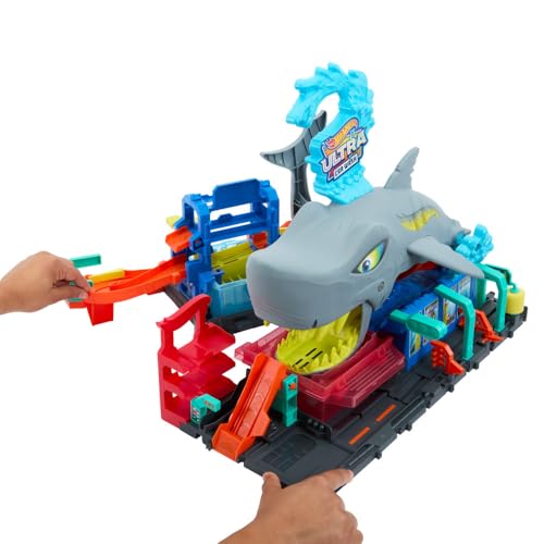 Hot Wheels City toy car track set featuring Ultra Shark car wash and color reveal toy car, designed for 1:64 scale cars.